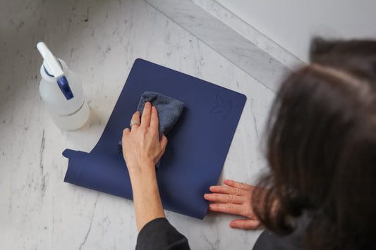 Esthetician cleaning a DuraVie reusable silicone cover between clients